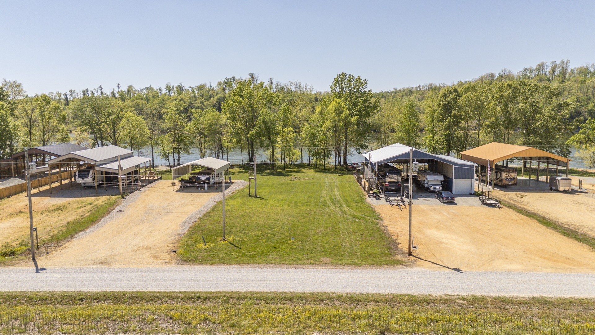 855 Hardin Bottom River Road Clifton, TN 38425 - Photo 5 of 30 a view of swimming pool with outdoor seating and trees in the background