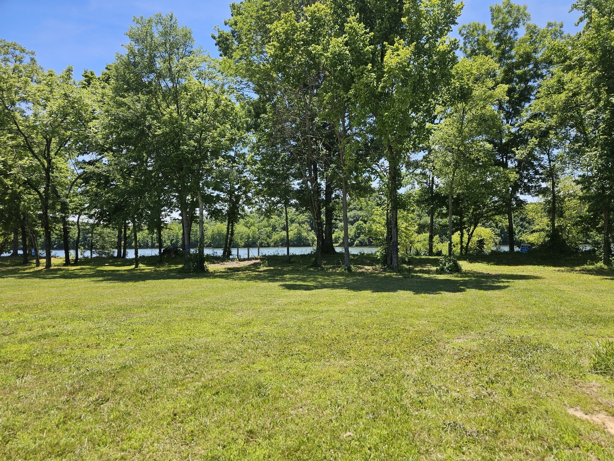 855 Hardin Bottom River Road Clifton, TN 38425 - Photo 7 of 30 a view of a swimming pool with an outdoor space and seating