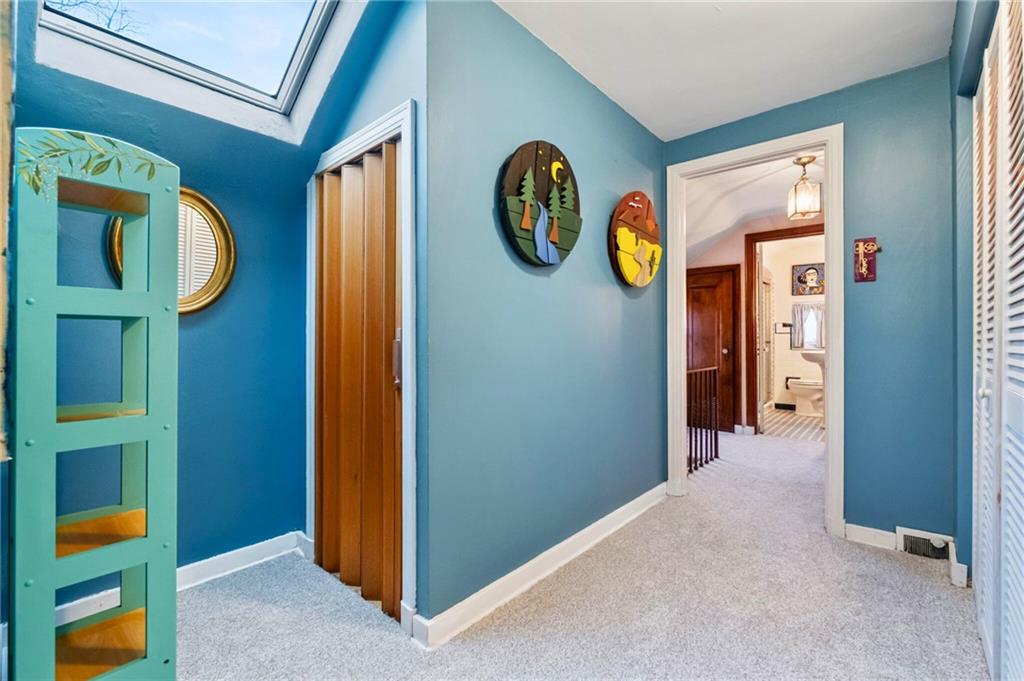 173 Spring Grove Road Pittsburgh, PA 15235 - Photo 17 of 30 a view of a hallway with entryway and wooden floor