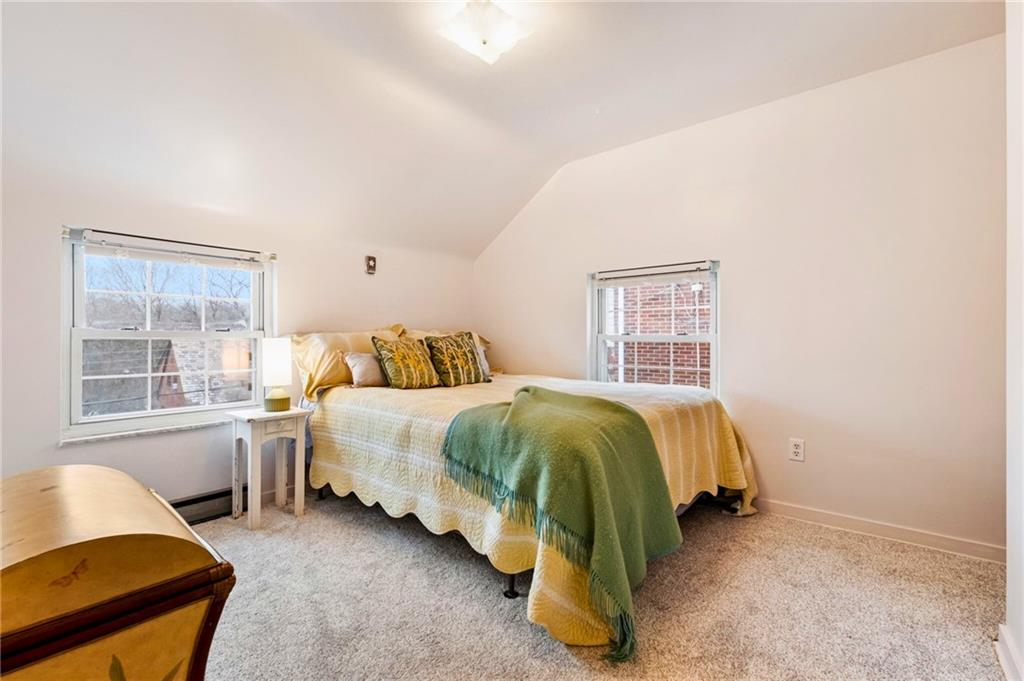 173 Spring Grove Road Pittsburgh, PA 15235 - Photo 19 of 30 a spacious bedroom with a bed and a window