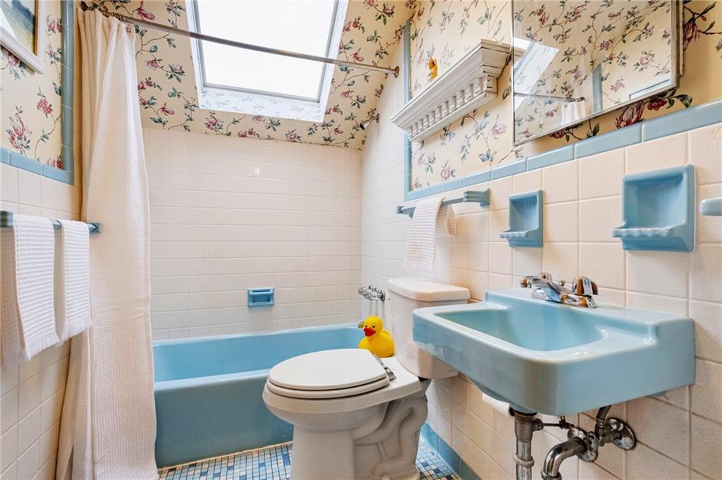 173 Spring Grove Road Pittsburgh, PA 15235 - Photo 23 of 30 a bathroom with a sink a toilet and shower