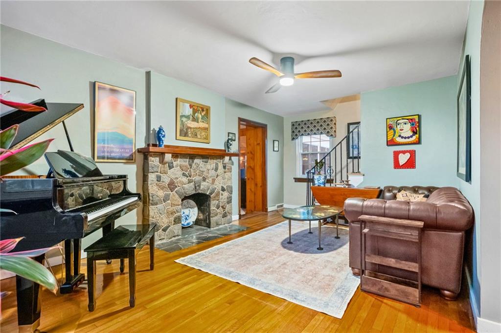 173 Spring Grove Road Pittsburgh, PA 15235 - Photo 9 of 30 a room with furniture and a fireplace