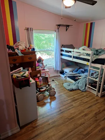 a room with wooden floors and a table