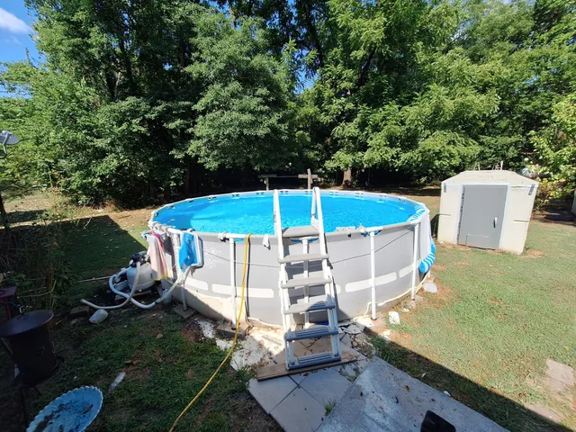 a view of a swimming pool with a patio