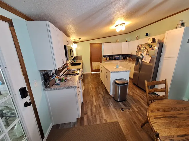 a view of walk in closet with clothes washer and dryer