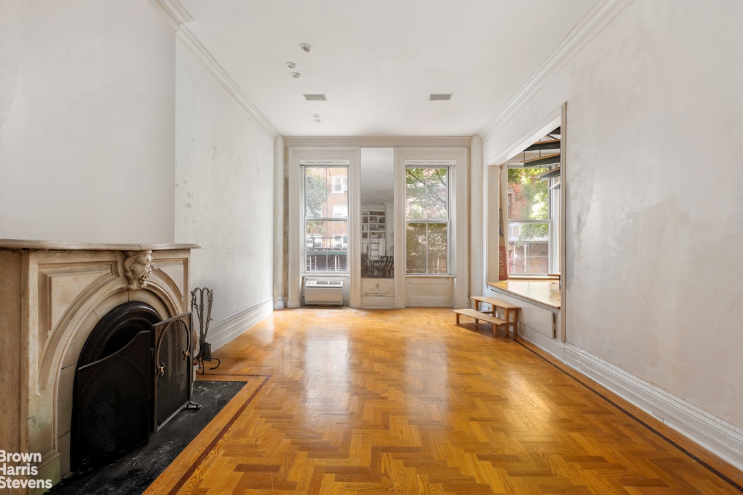 233 East 35th Street Manhattan, NY 10016 - Photo 3 of 6 a view of an empty room with washing machine and a window