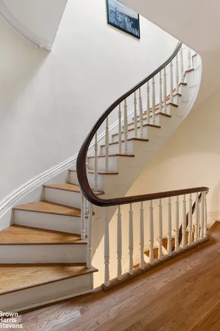 a view of an empty room with washing machine and a window