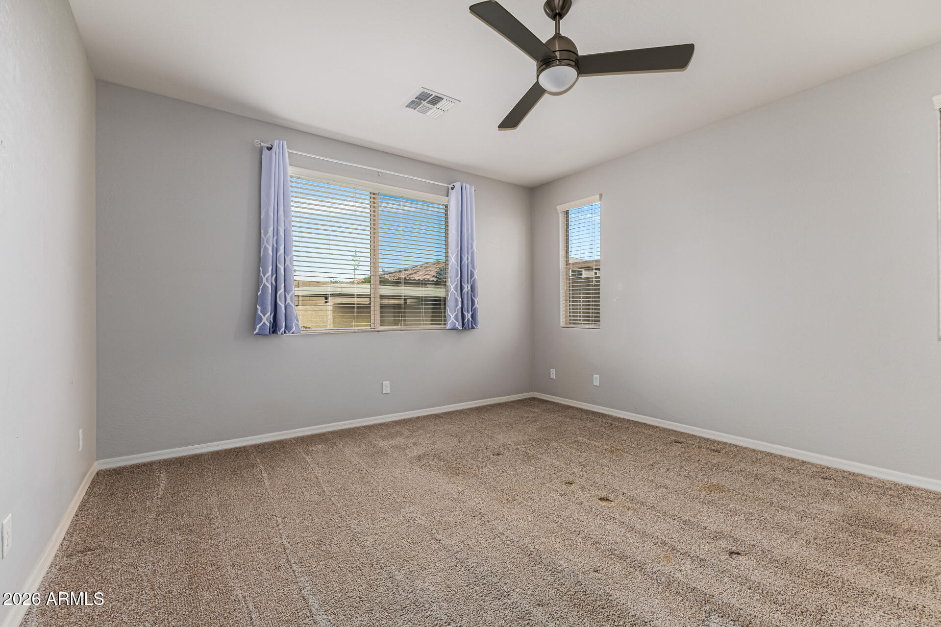 15768 West Pierce Street Goodyear, AZ 85338 - Photo 16 of 38 Primary Bedroom