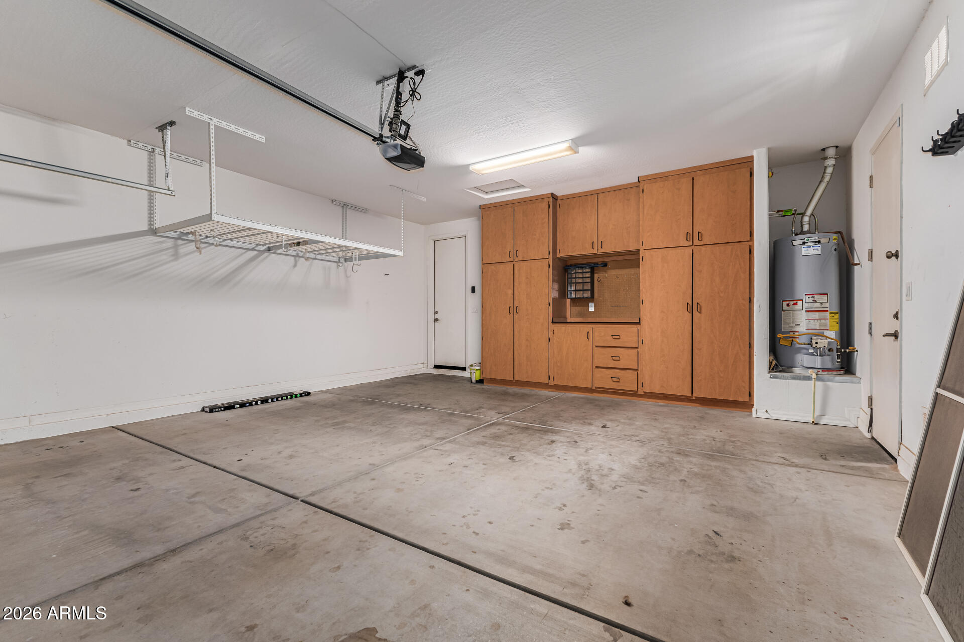 15768 West Pierce Street Goodyear, AZ 85338 - Photo 31 of 38 Garage with Storage Cabinets