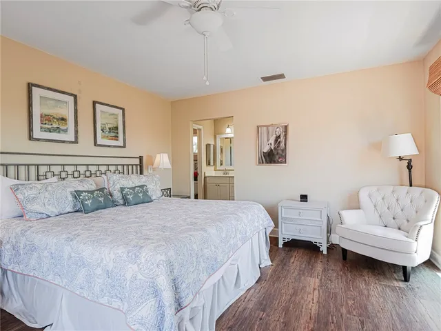 a spacious bedroom with a bed and a couch