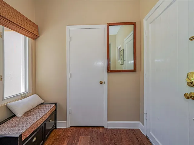 a view of room with window and wooden floor