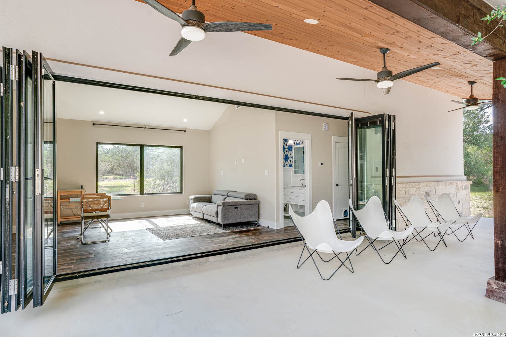 316 Prairie Tea Lane Spring Branch, TX 78070 - Photo 26 of 38 a living room with furniture and a large window