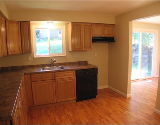 839 Unity Trestle Road Plum, PA 15239 - Photo 3 of 18 Kitchen. THE NEW WOOD LAMINATE FLOOR ACCENTS THE CABINETS, AND ALSO EXTENDS INTO THE DINING ROOM.