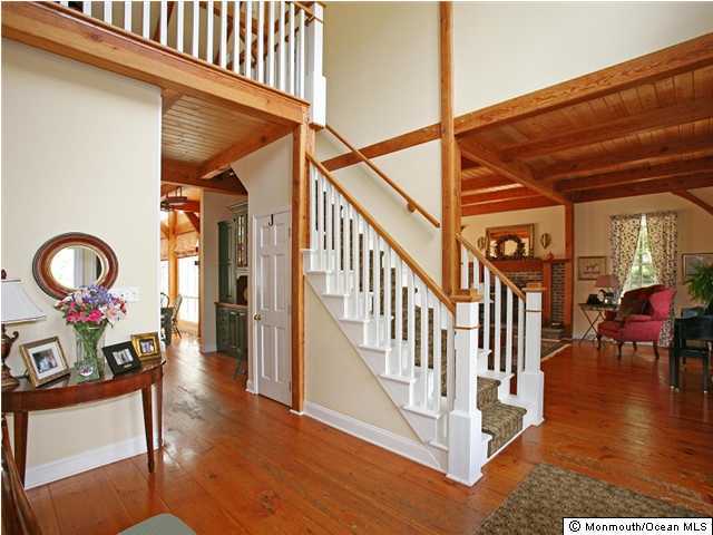 3 Bucklin Road Colts Neck, NJ 07722 - Photo 2 of 3 a view of a hallway with wooden floor and windows