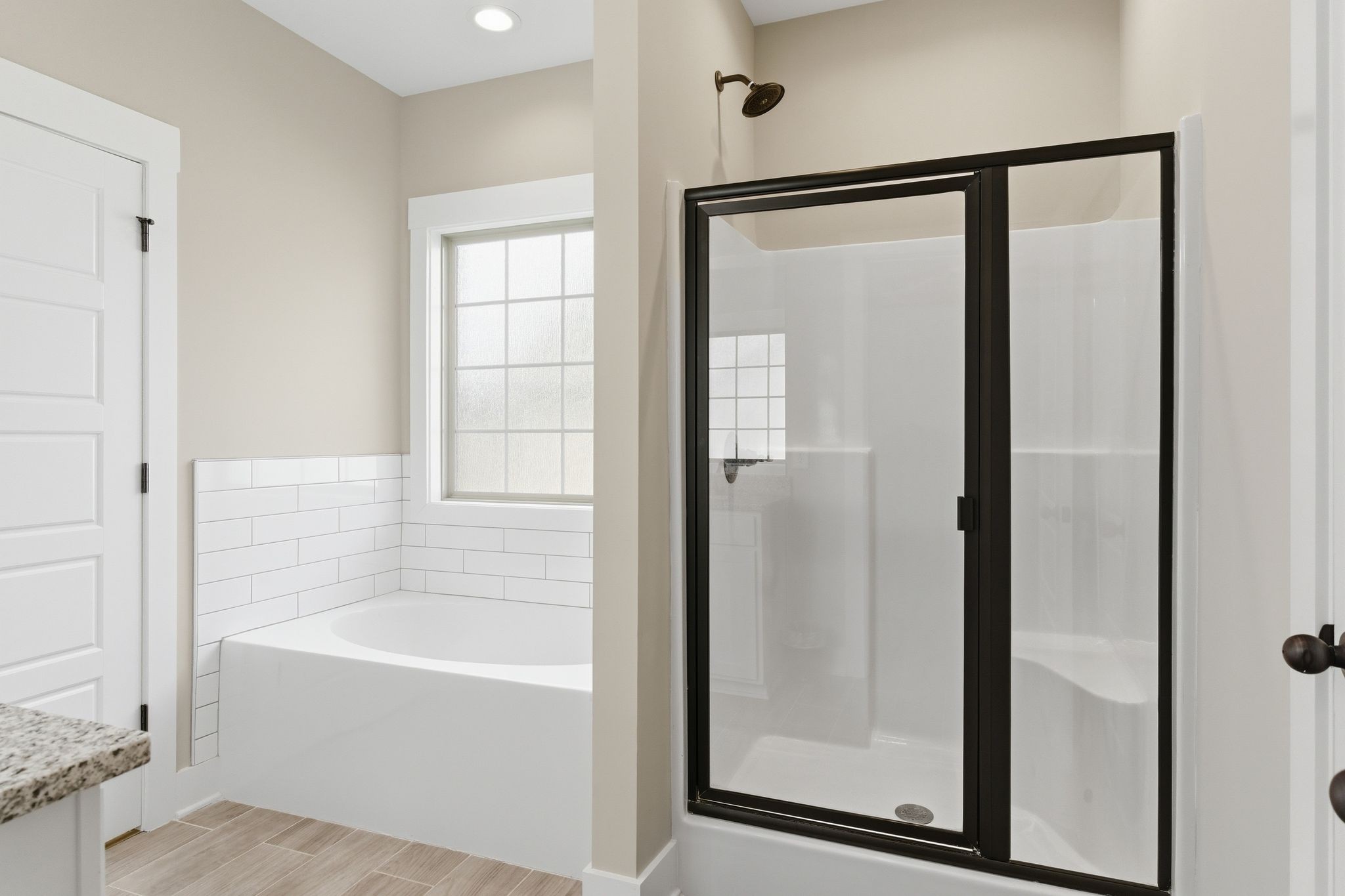 217 Julia Ann Court Springfield, TN 37172 - Photo 15 of 26 a bathroom with a bathtub and a shower