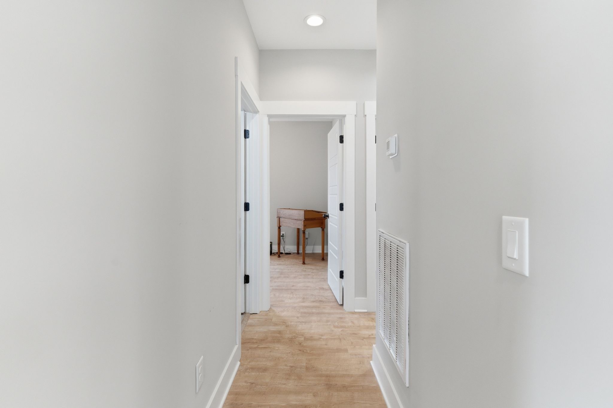 217 Julia Ann Court Springfield, TN 37172 - Photo 16 of 26 a view of a hallway with wooden floor and a bathroom