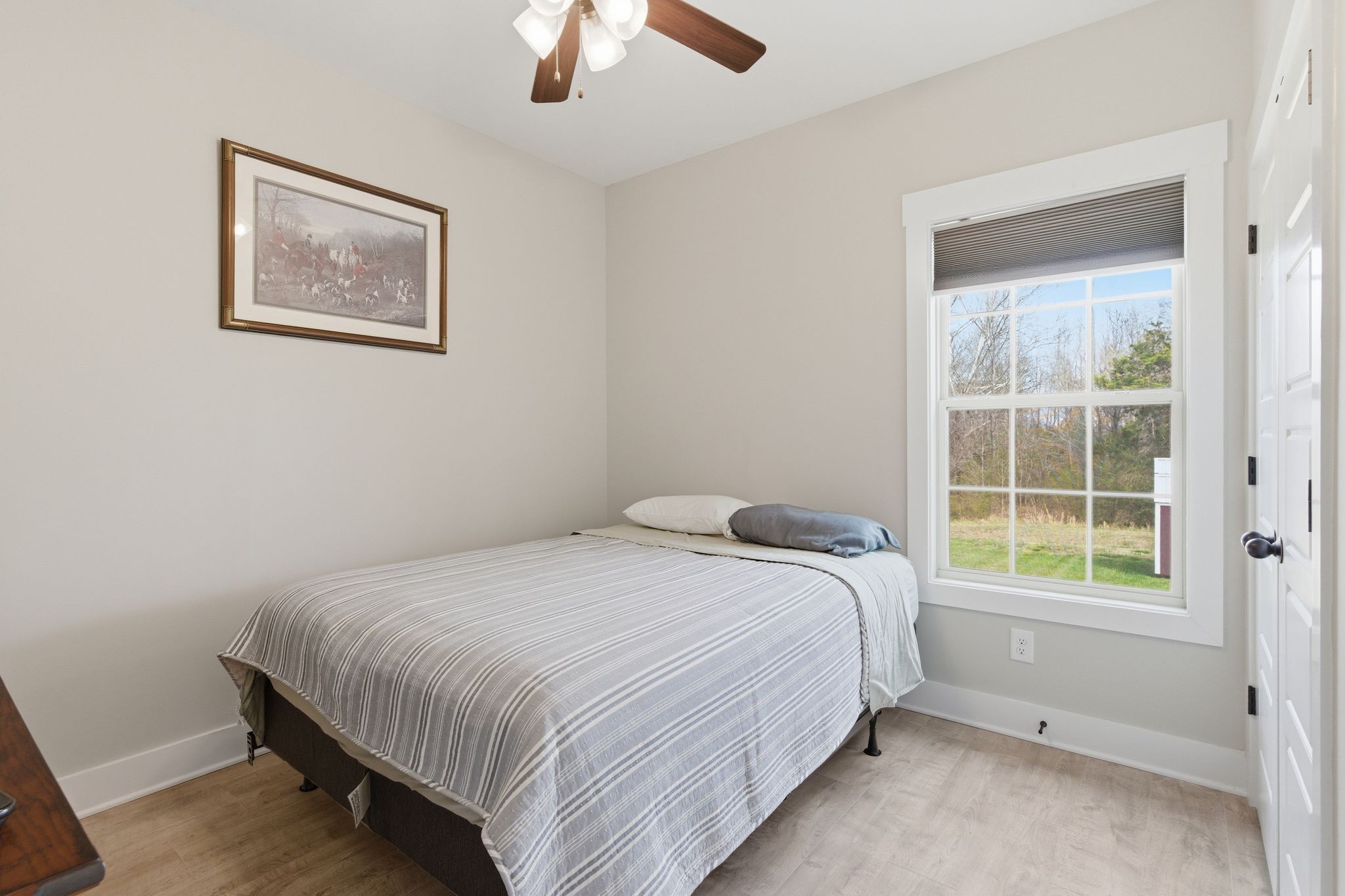 217 Julia Ann Court Springfield, TN 37172 - Photo 18 of 26 a bedroom with a bed and a window