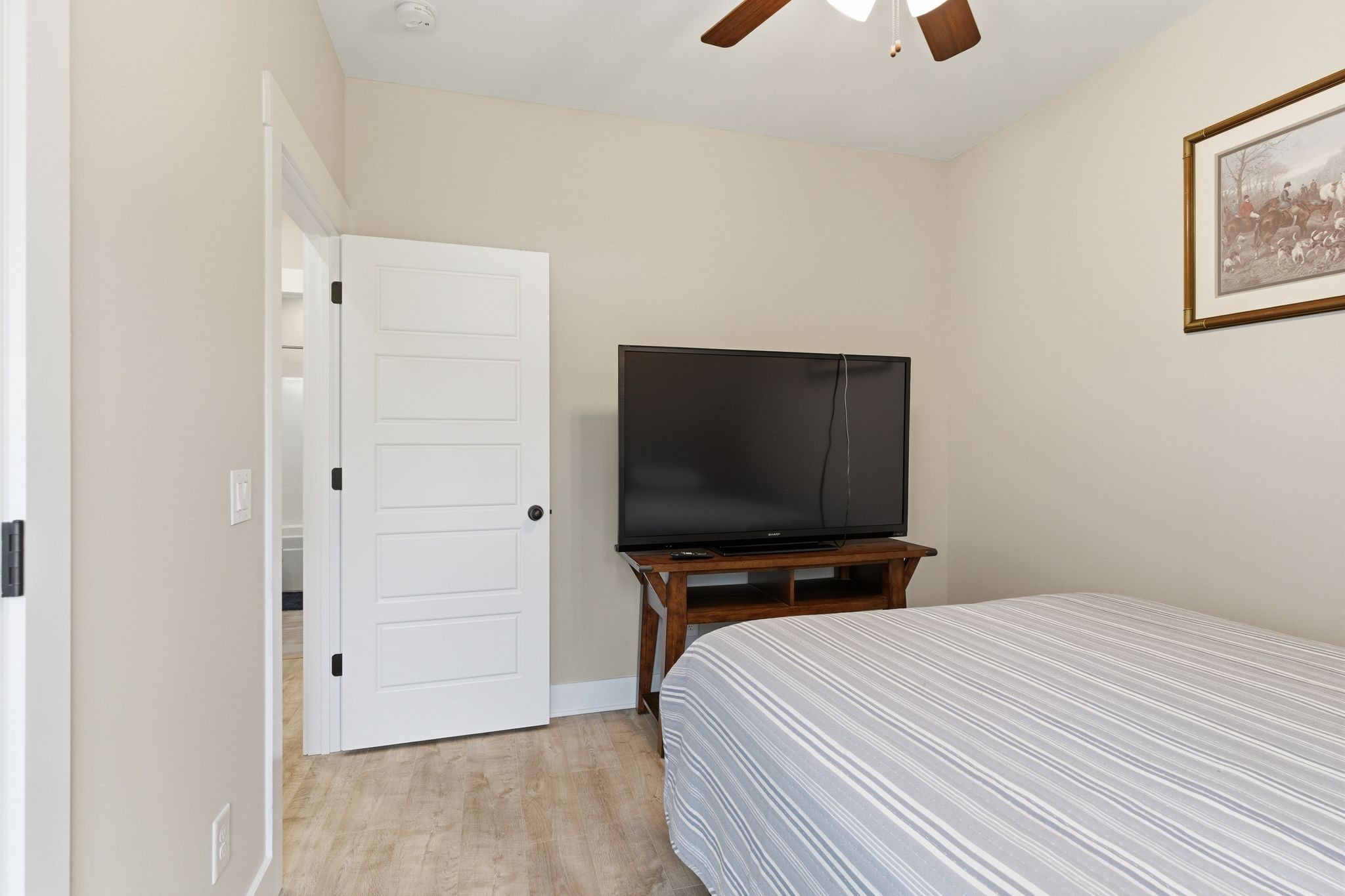 217 Julia Ann Court Springfield, TN 37172 - Photo 19 of 26 a bedroom with a bed and a flat screen tv