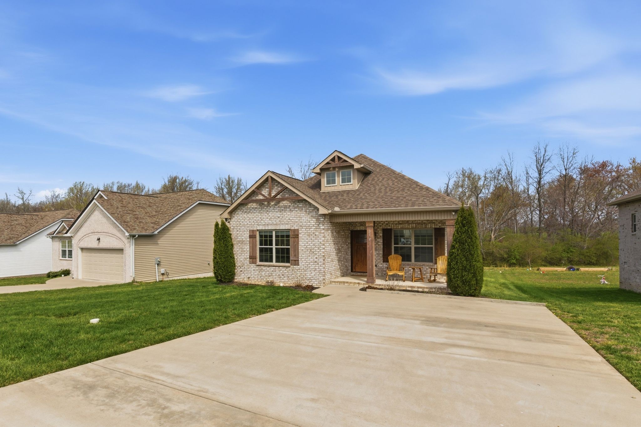217 Julia Ann Court Springfield, TN 37172 - Photo 2 of 26 a front view of a house with a yard and trees