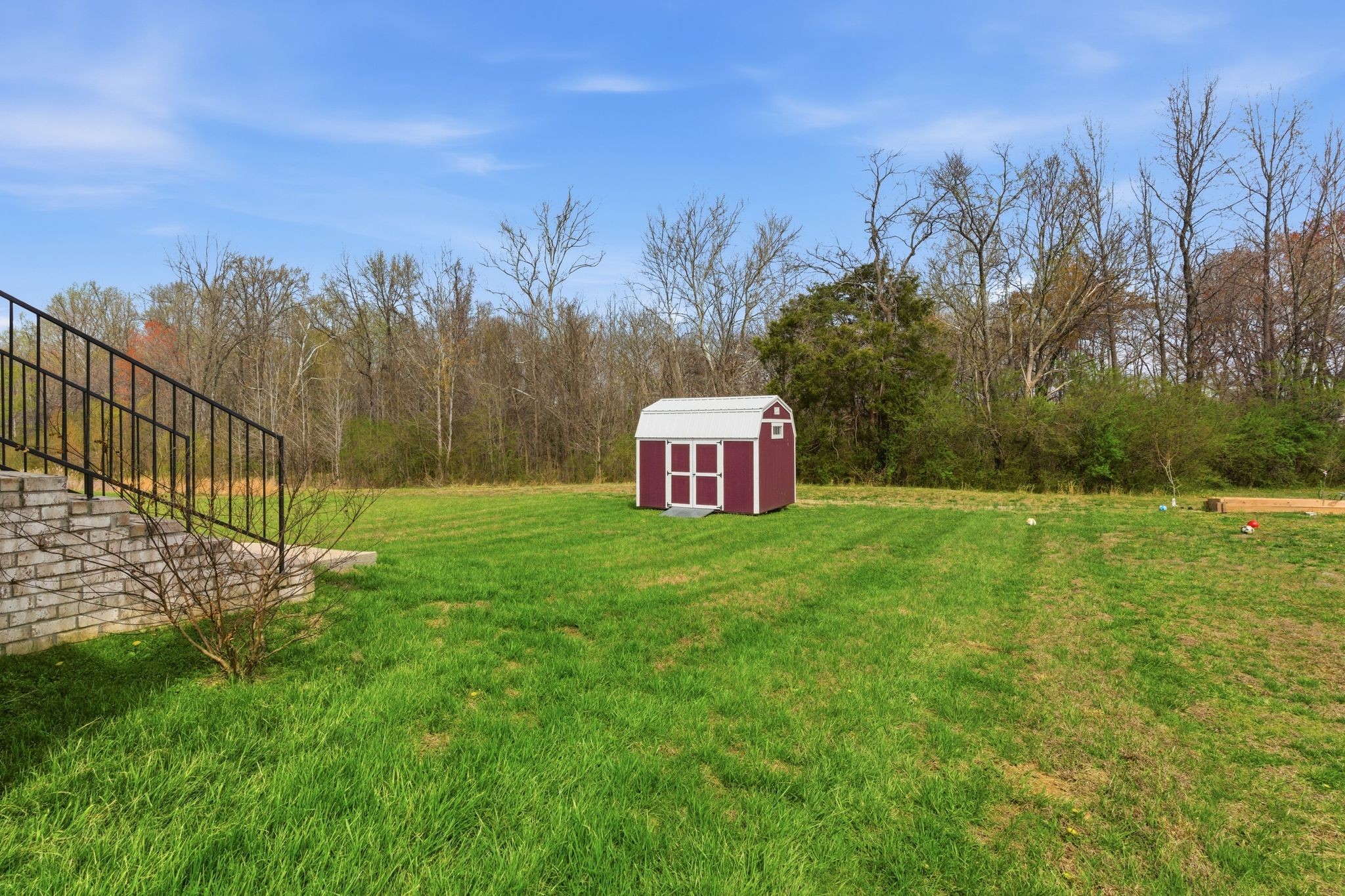 217 Julia Ann Court Springfield, TN 37172 - Photo 24 of 26 a view of a lush green space with a building in the background
