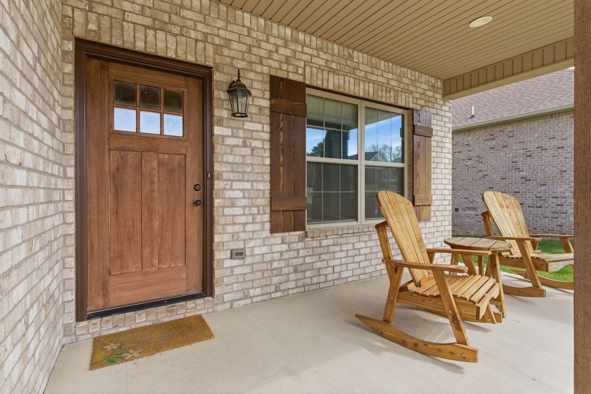217 Julia Ann Court Springfield, TN 37172 - Photo 3 of 26 a patio with table and chairs and potted plants