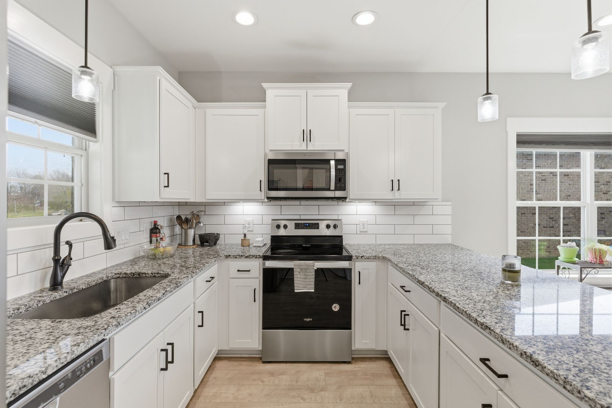 217 Julia Ann Court Springfield, TN 37172 - Photo 9 of 26 a kitchen with granite countertop a stove sink and cabinets