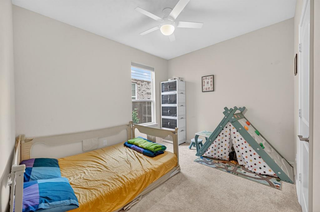 11320 Twisting Peak Road Fort Worth, TX 76052 - Photo 15 of 23 a bedroom with a bed and a window