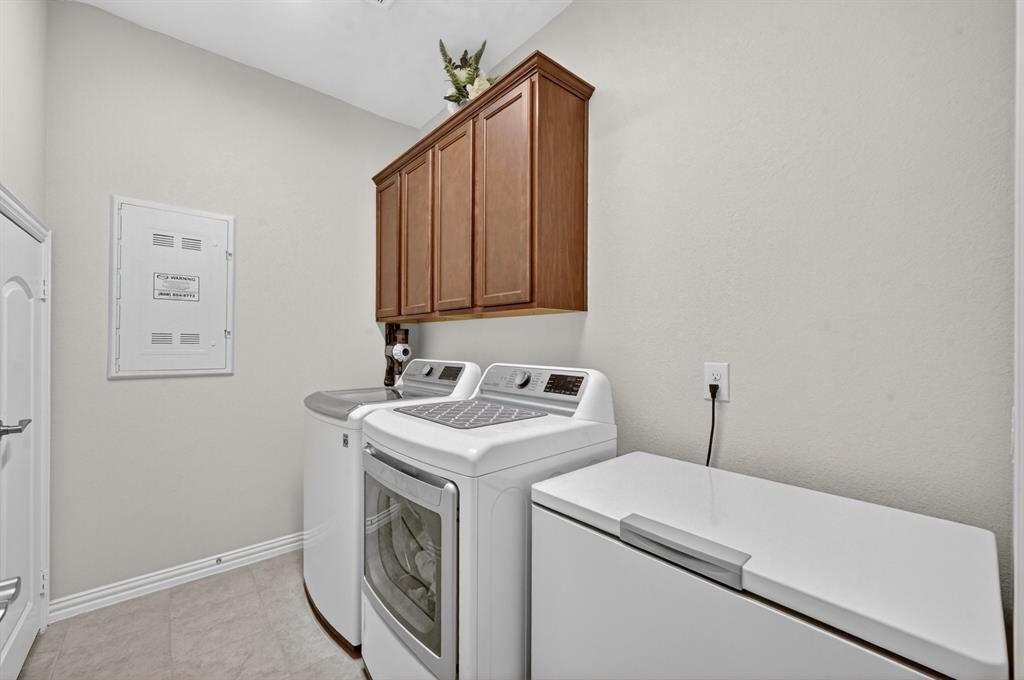 11320 Twisting Peak Road Fort Worth, TX 76052 - Photo 18 of 23 a utility room with dryer and washer