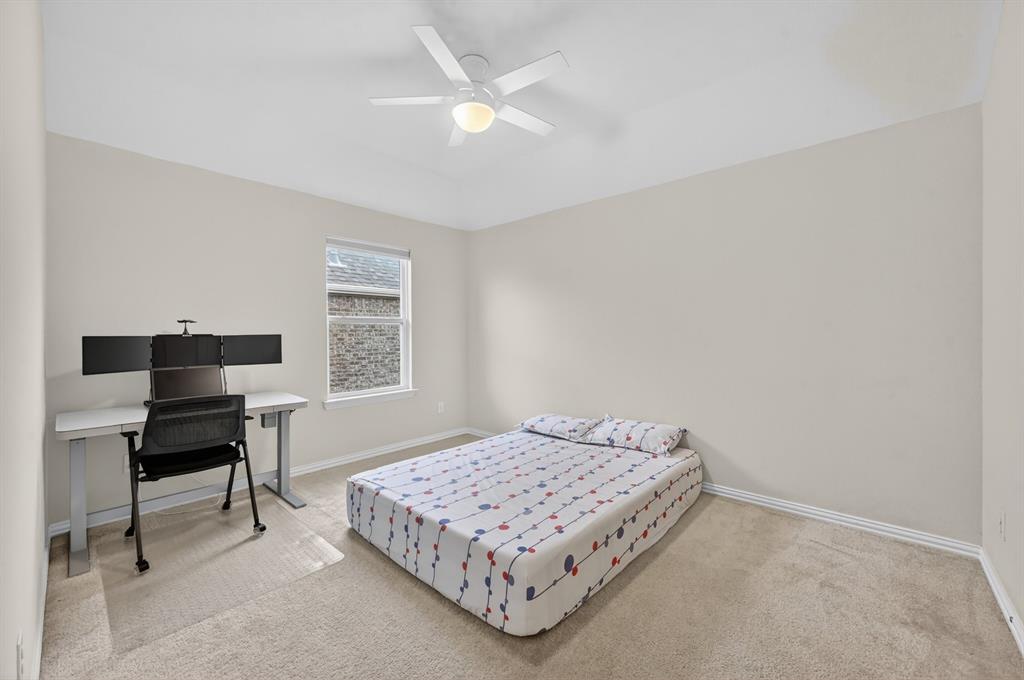 11320 Twisting Peak Road Fort Worth, TX 76052 - Photo 20 of 23 a bedroom with a bed table chair and a window