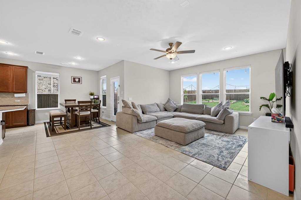 11320 Twisting Peak Road Fort Worth, TX 76052 - Photo 2 of 23 a living room with furniture and a flat screen tv