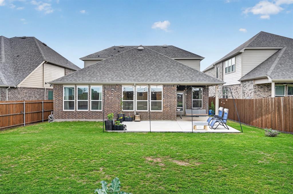 11320 Twisting Peak Road Fort Worth, TX 76052 - Photo 22 of 23 a view of a house with a yard and sitting area