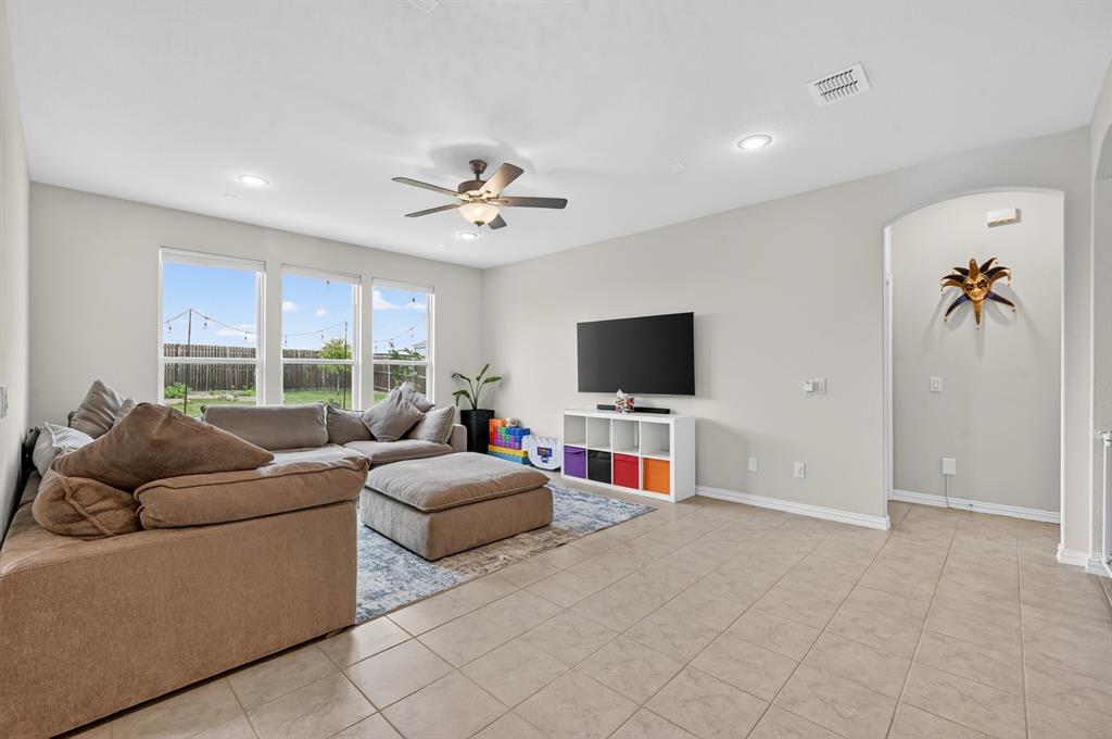 11320 Twisting Peak Road Fort Worth, TX 76052 - Photo 3 of 23 a living room with furniture and a flat screen tv