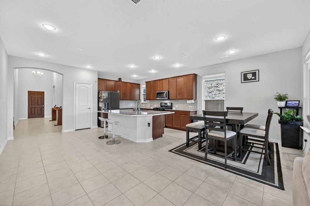 11320 Twisting Peak Road Fort Worth, TX 76052 - Photo 5 of 23 a living room with lots of furniture and kitchen view