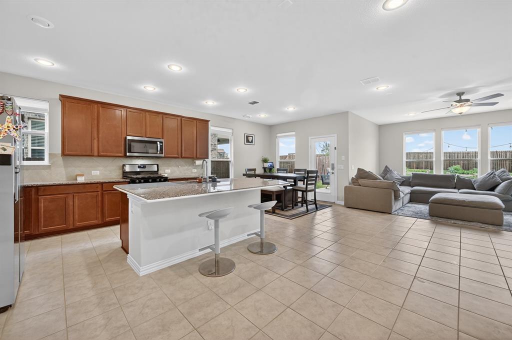 11320 Twisting Peak Road Fort Worth, TX 76052 - Photo 8 of 23 a living room with furniture and a large window