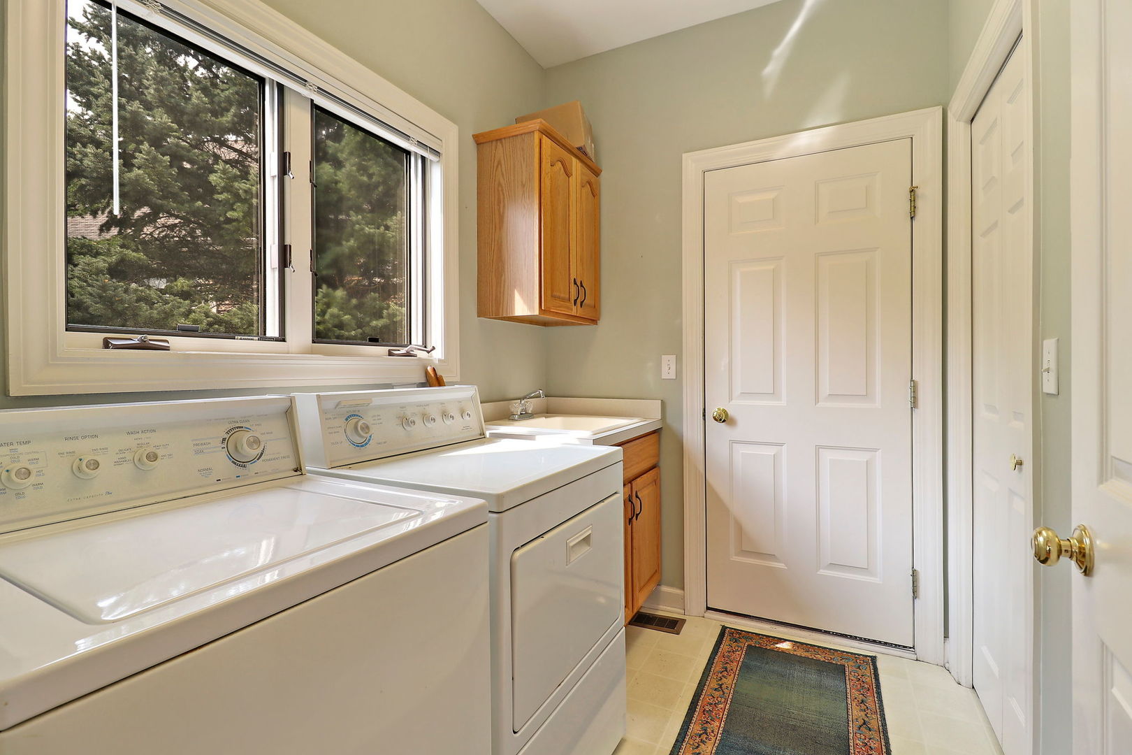 4 Riviera Court Lake In The Hills, IL 60156 - Photo 12 of 33 a view of a bathroom with a sink and a window
