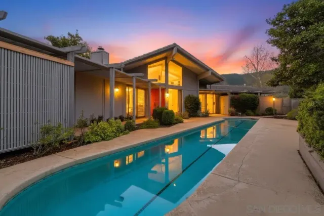 a view of house with outdoor space and entertaining space