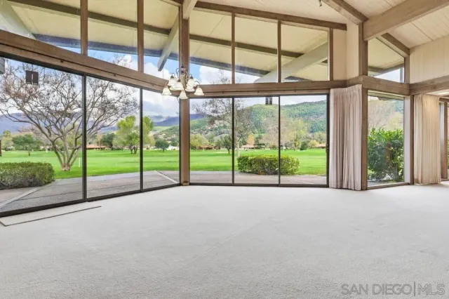 a view of an empty room with a large window