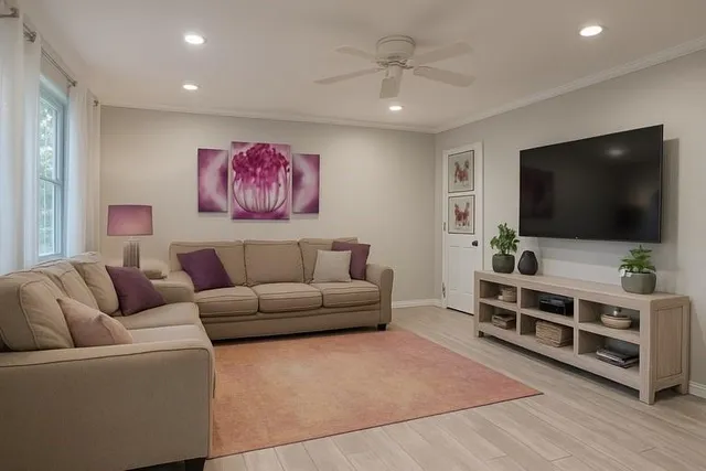 a living room with furniture and a flat screen tv