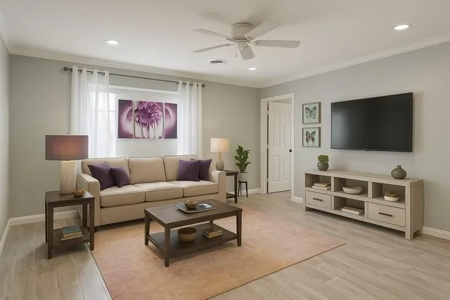 a living room with furniture and a flat screen tv