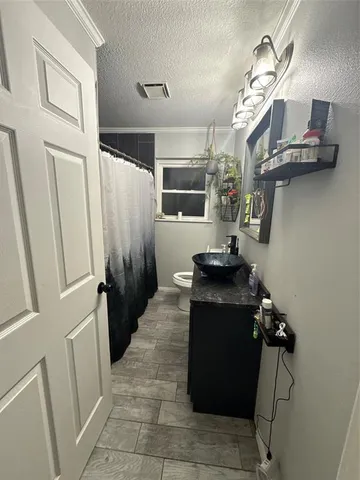 a living room with a furniture and a fireplace