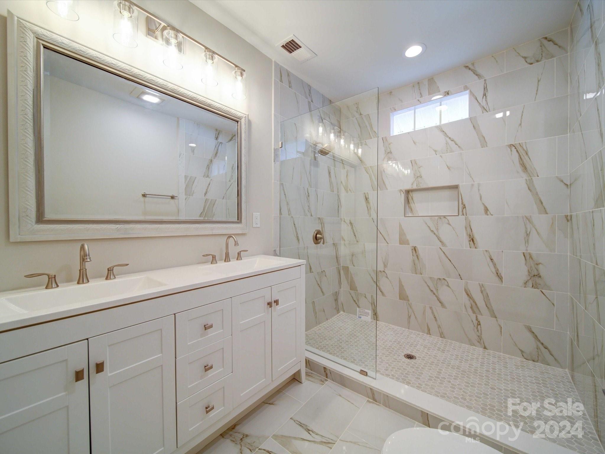 113 Graham Street Chester, SC 29706 - Photo 11 of 22 a bathroom with a shower sink and mirror