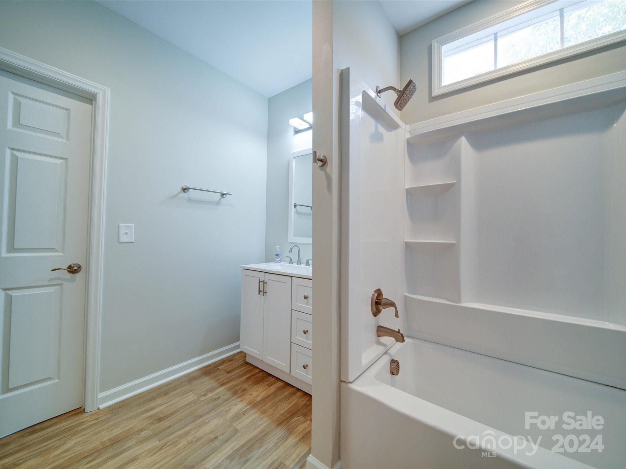 113 Graham Street Chester, SC 29706 - Photo 16 of 22 a bathroom with a bathtub and a shower