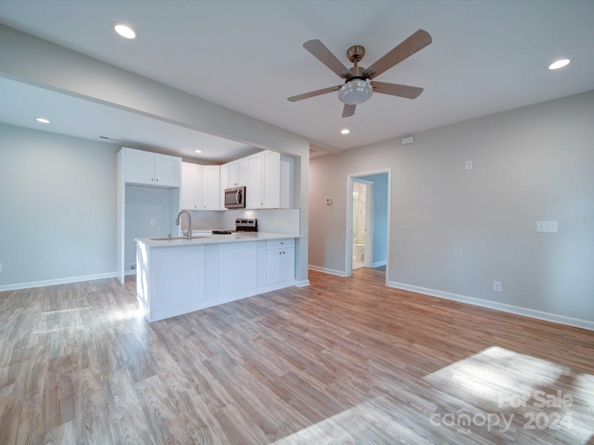 113 Graham Street Chester, SC 29706 - Photo 7 of 22 a view of kitchen with granite countertop cabinets and stainless steel appliances