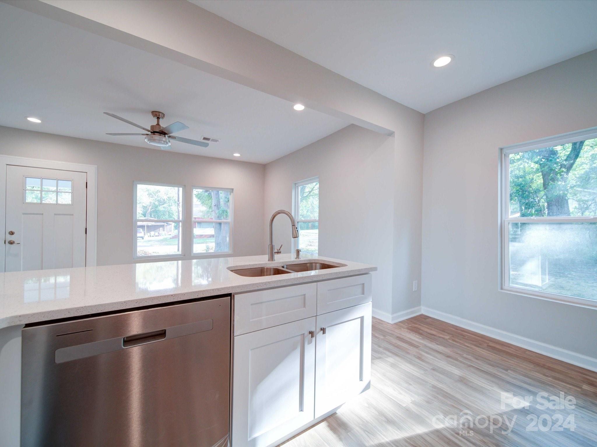 113 Graham Street Chester, SC 29706 - Photo 8 of 22 a kitchen with a sink window and cabinets