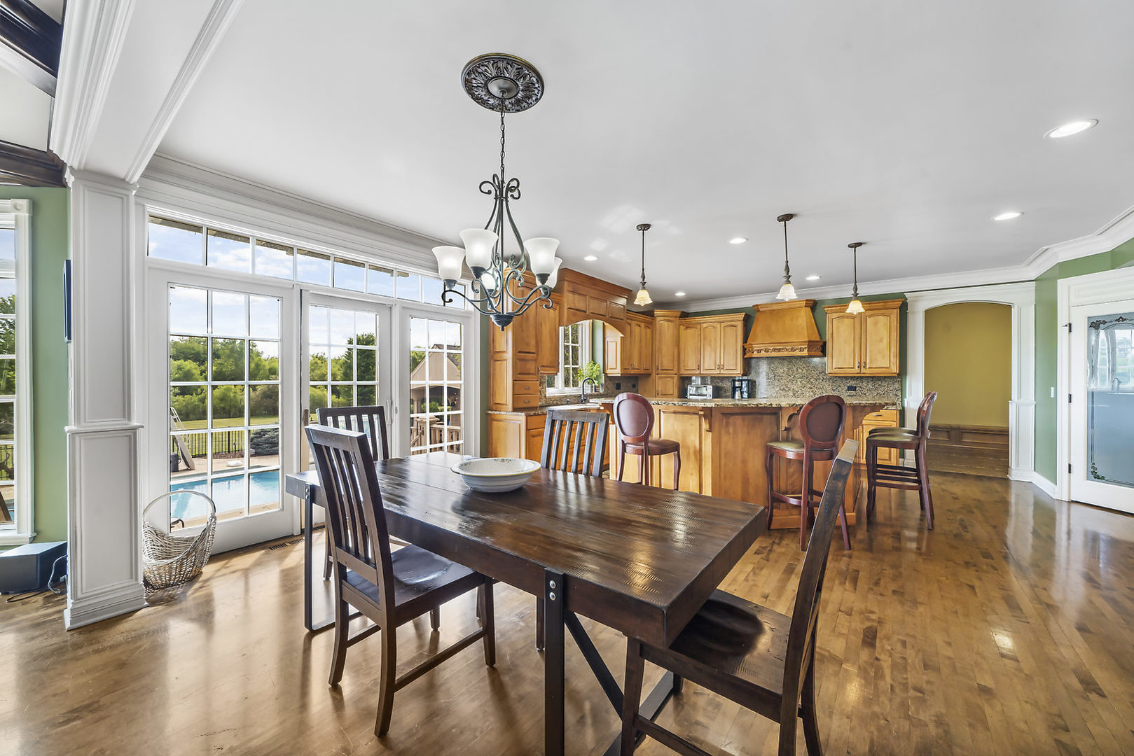 40W885 Campton Trail Road St. Charles, IL 60175 - Photo 12 of 29 a view of a dining room and livingroom with furniture wooden floor a chandelier