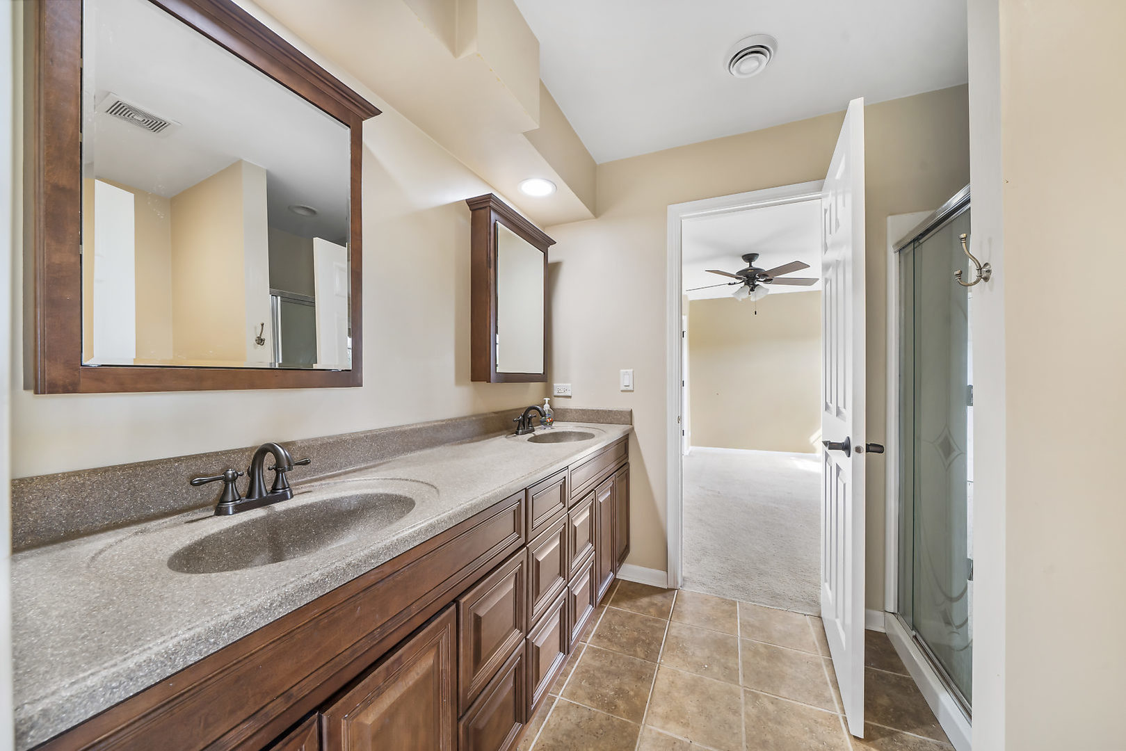 40W885 Campton Trail Road St. Charles, IL 60175 - Photo 22 of 29 a bathroom with a sink double vanity and a mirror