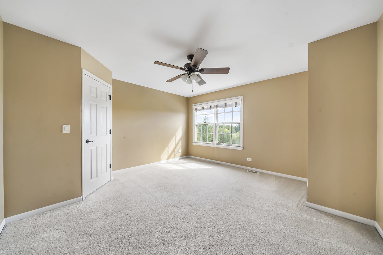 40W885 Campton Trail Road St. Charles, IL 60175 - Photo 23 of 29 an empty room with windows and fan
