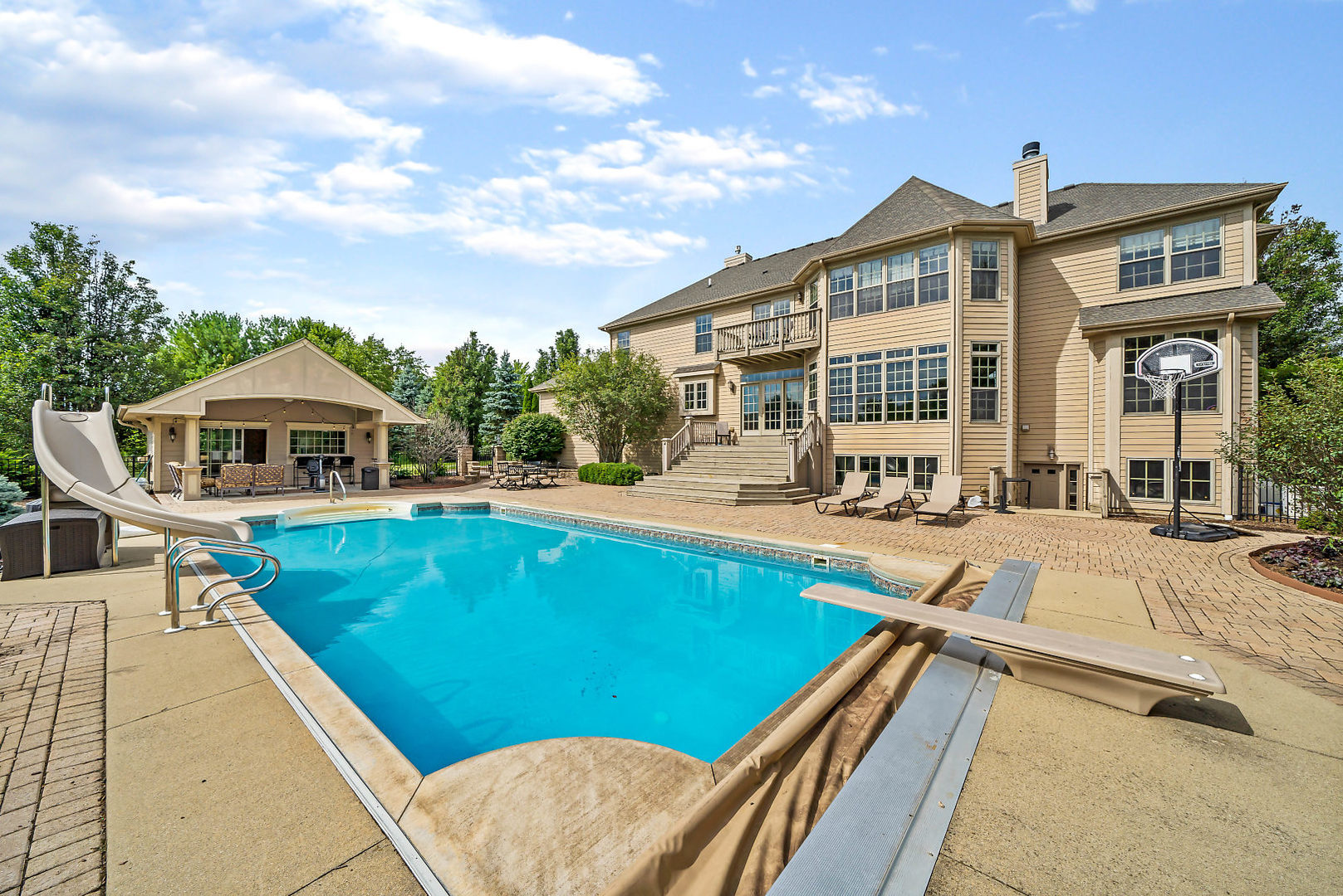 40W885 Campton Trail Road St. Charles, IL 60175 - Photo 25 of 29 a view of a house with pool and chairs