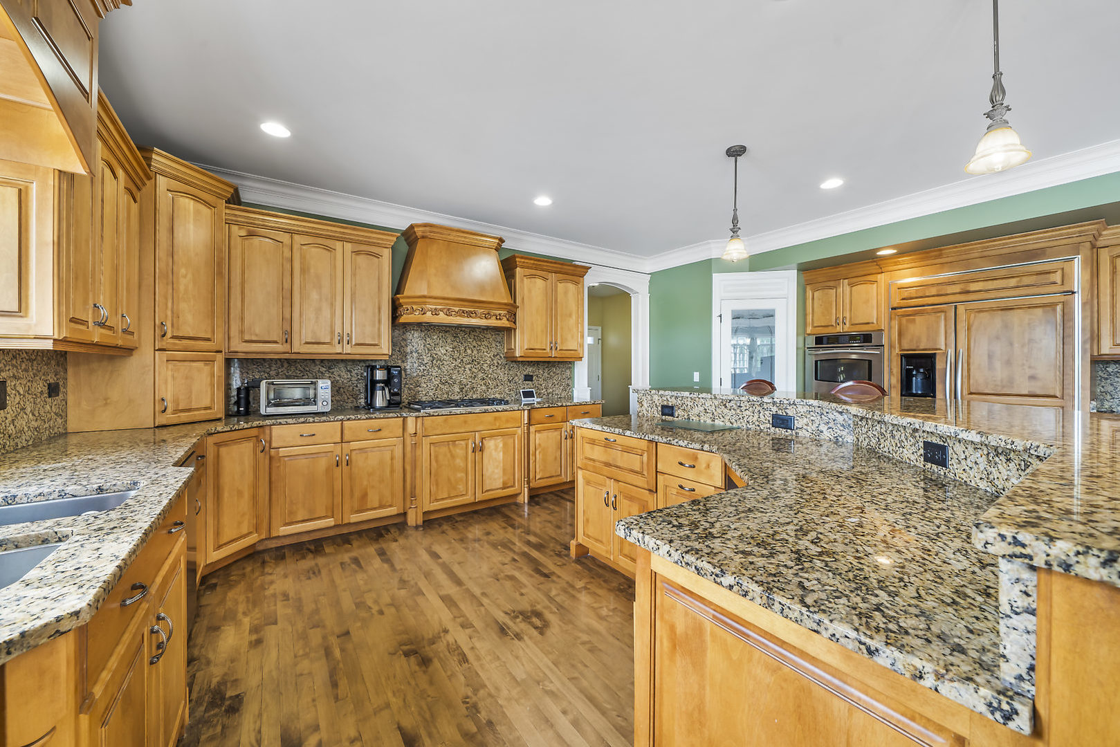 40W885 Campton Trail Road St. Charles, IL 60175 - Photo 9 of 29 a large kitchen with kitchen island granite countertop a large window