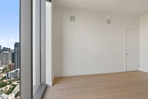 wooden floor in an empty room with window